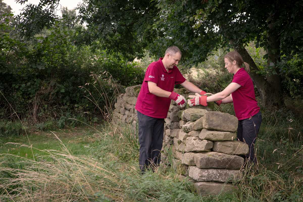 Rangers fixing dry stone wall credit Polly Baldwin