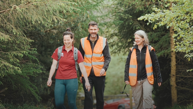 Malcolm leading walk with staff credit Lambat Creaxive Studios